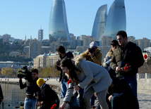 Baku residents bringing flowers to Seaside Boulevard to honor missing oil workers.  Azerbaijan, Dec.07, 2015